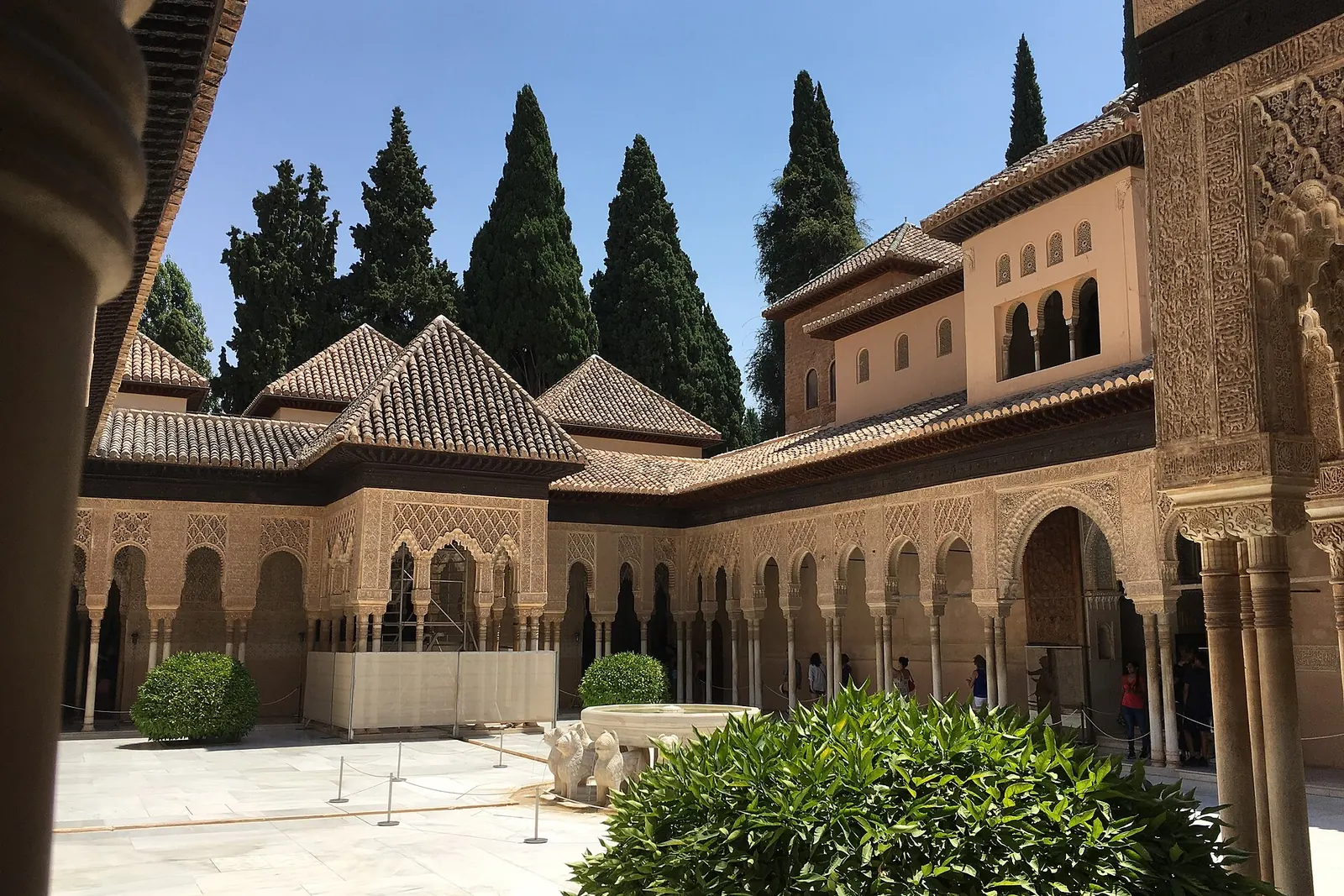 The Court of the Lions in the Alhambra, with its slender columns, arcades and a central fountain with lion sculptures